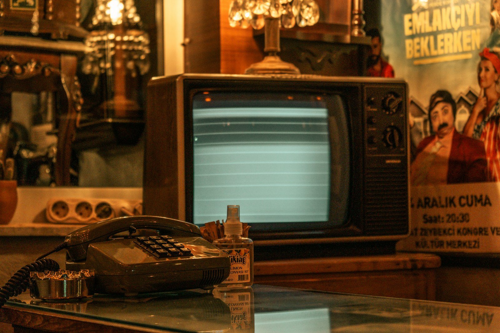 an old fashioned telephone sitting on top of a glass table