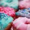 shallow focus photography of assorted doughnuts with sprinkles