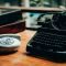 an old fashioned typewriter sitting on top of a wooden table