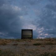 black CRT television on soil