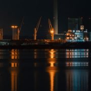 A large body of water with a city in the background