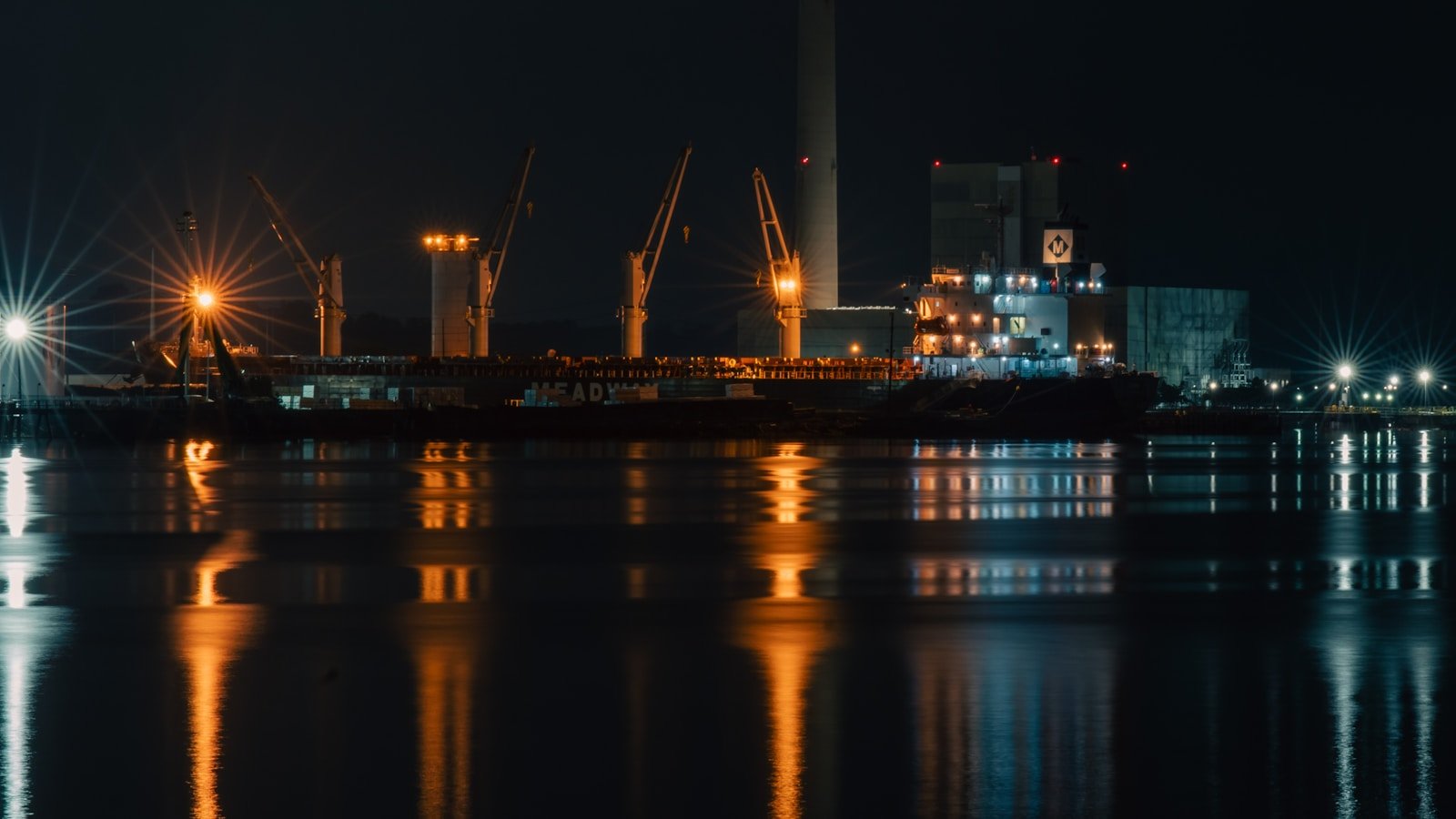 A large body of water with a city in the background