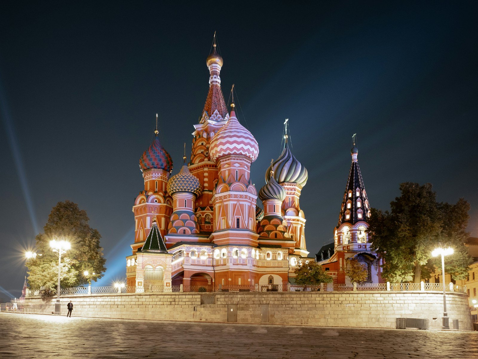 a large building with many spires lit up at night